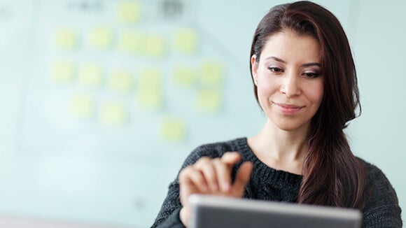 woman-working-on-tablet-computer woman-working-on-tablet-computer