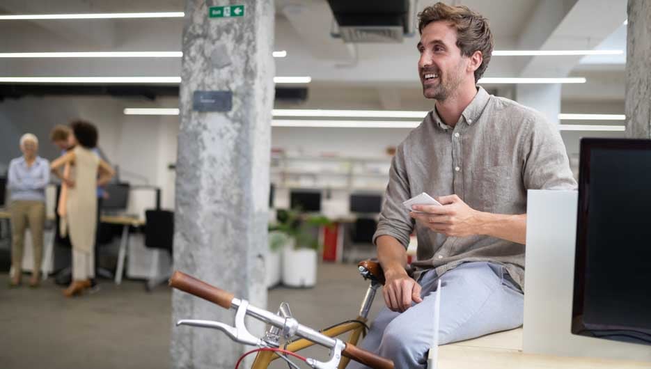 Busy trendy office with happy business people achieving success